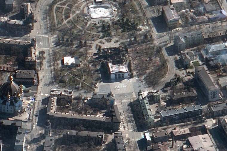 MAXAR TECHNOLOGIES / AP This satellite image provided by Maxar Technologies shows the aftermath of the airstrike on the Mariupol Drama theater, Ukraine, and the area around it.