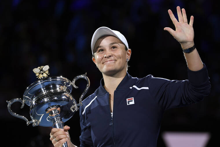 ASSOCIATED PRESS / JAN. 29
                                Ash Barty of Australia waves as she holds the Daphne Akhurst Memorial Cup after defeating Danielle Collins of the U.S., in the women’s singles final at the Australian Open tennis championships in Melbourne, Australia.