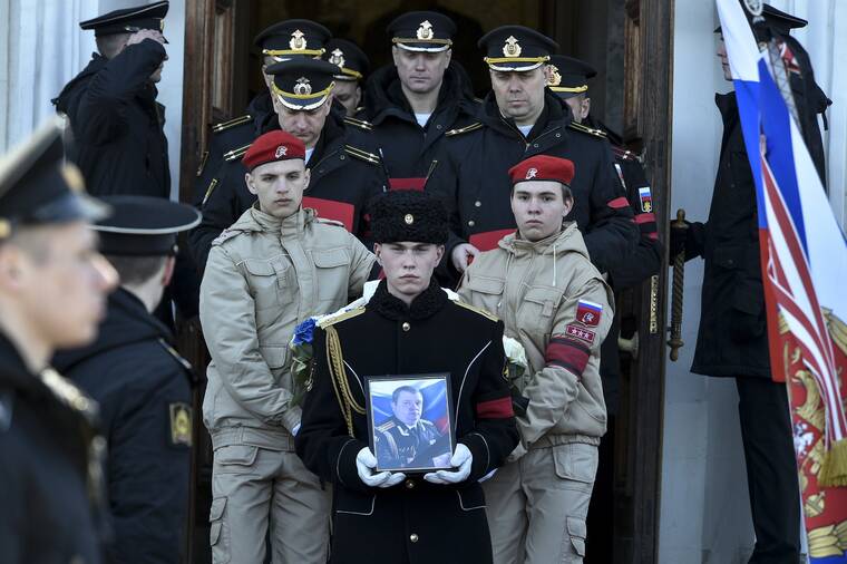 ASSOCIATED PRESS
                                A serviceman carried the photo of Capt. Andrei Paliy, a deputy commander of Russia’s Black Sea Fleet, during a farewell ceremony in Sevastopol, Crimea, today. Paliy was killed in action during fighting with Ukrainian forces in the Sea of Azov port of Mariupol.