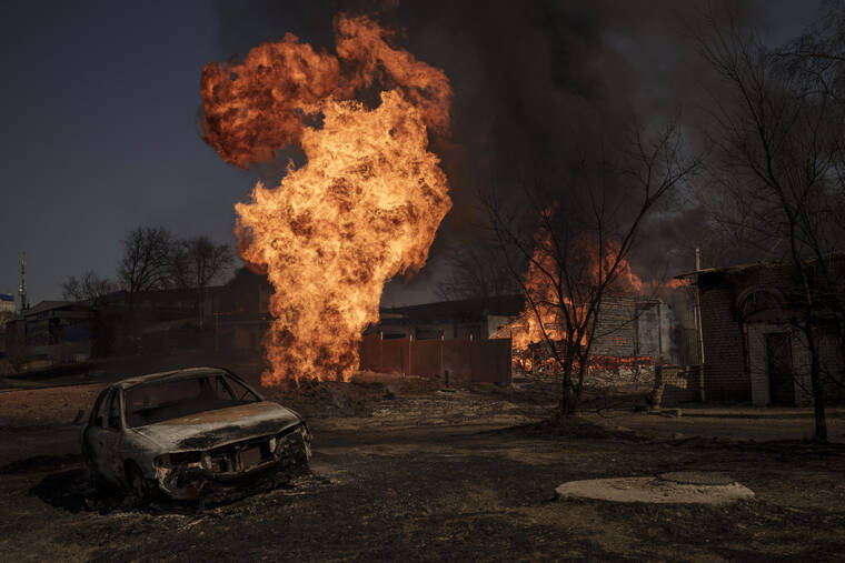 ASSOCIATED PRESS
                                Flames and smoke rise from a fire following a Russian attack in Kharkiv, Ukraine, on Friday.