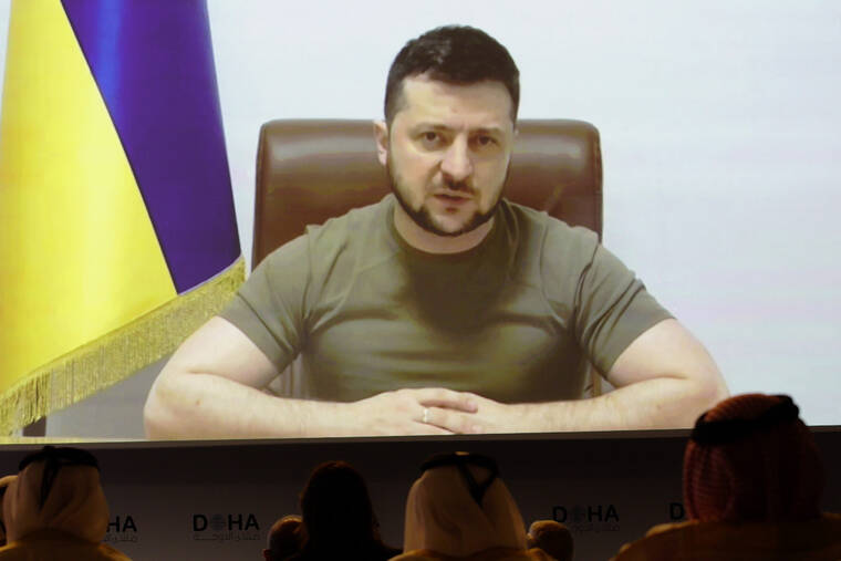 ASSOCIATED PRESS
                                Ukrainian President Volodymyr Zelenskyy speaks via video call to the Doha Forum in Doha, Qatar, today.