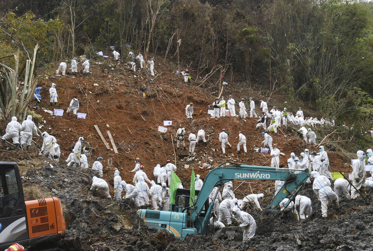 XINHUA / AP
                                Rescuers conduct search and rescue work at the core site of Monday’s plane crash in Tengxian County, southern China’s Guangxi Zhuang Autonomous Region, Friday, March 25.