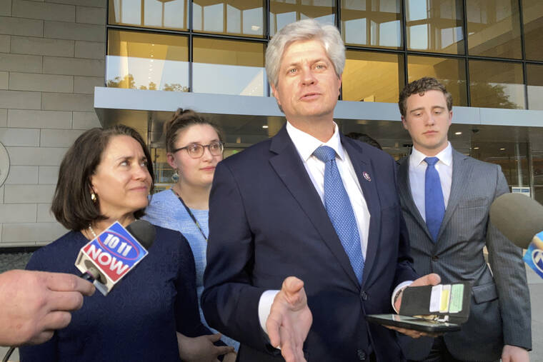 ASSOCIATED PRESS / MARCH 24
                                U.S. Rep. Jeff Fortenberry, R-Neb., center, speaks with the media outside the federal courthouse in Los Angeles. Fortenberry was convicted Thursday of charges that he lied to federal authorities about an illegal $30,000 contribution to his campaign from a foreign billionaire at a 2016 Los Angeles fundraiser.
