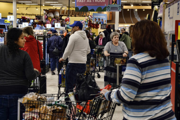 ASSOCIATED PRESS
                                Shoppers wait in lines to check out at a Ralphs supermarket on March 13, 2020, in the Panorama City section of Los Angeles. Thousands of southern and central California grocery workers began voting March 21 on whether to authorize their union to call a strike against several major supermarket chains.