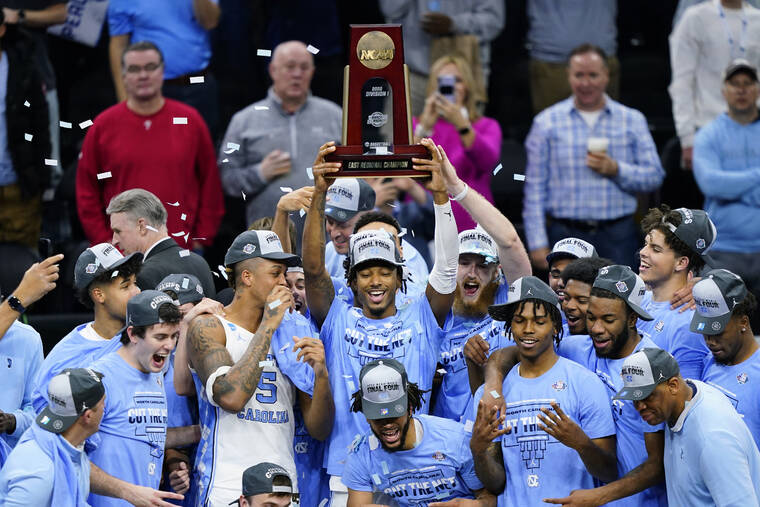 ASSOCIATED PRESS
                                North Carolina players celebrate after North Carolina won a college basketball game against St. Peter’s in the Elite 8 round of the NCAA tournament today in Philadelphia.