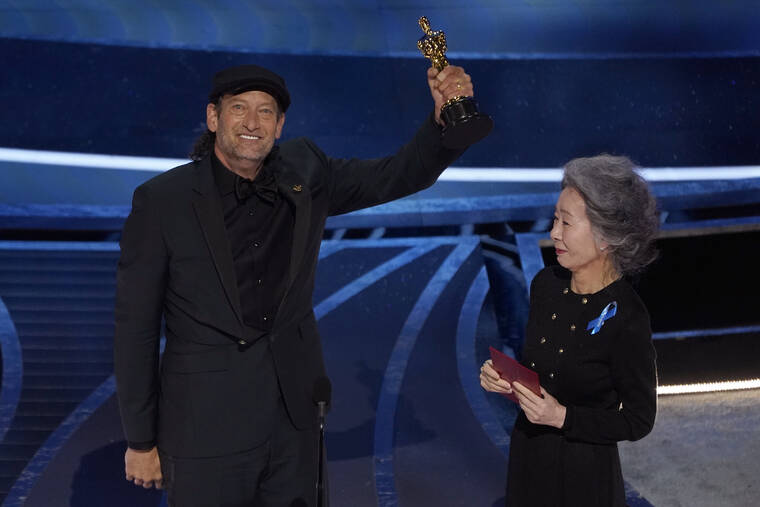 ASSOCIATED PRESS
                                Youn Yuh-jung, right, presents Troy Kotsur with the award for best performance by an actor in a supporting role for “CODA” at the Oscars today at the Dolby Theatre in Los Angeles.