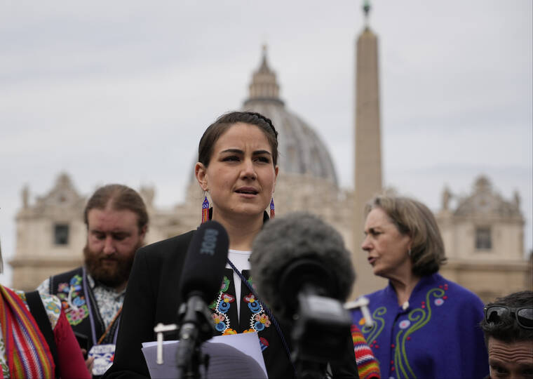ASSOCIATED PRESS
                                President of the Metis community, Cassidy Caron, spoke to the media in St. Peter’s Square after their meeting with Pope Francis at The Vatican, today.
