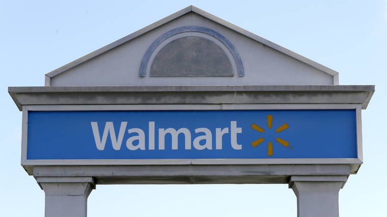 ASSOCIATED PRESS
                                A Walmart logo formed part of a sign outside a Walmart store, in Walpole, Mass. Walmart Inc. will no longer be selling cigarettes in some U.S. stores, a complicated move since tobacco is a money driver for many retailers.
