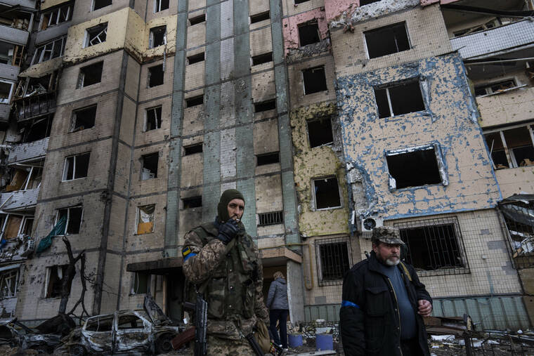 ASSOCIATED PRESS / MARCH 21
                                A soldier smokes a cigarette while walking next to a destroyed building after a bombing in Satoya neighborhood in Kyiv, Ukraine.