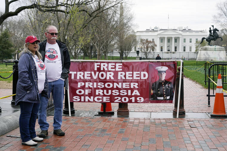 PATRICK SEMANSKY / AP
                                Joey and Paula Reed, parents of U.S. Marine Corps veteran and Russian prisoner Trevor Reed, stand in Lafayette Park near the White House in Washington.