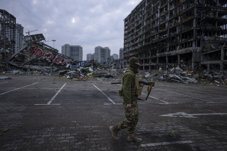 ASSOCIATED PRESS
                                A soldier walked amid the destruction caused after the March 21 shelling of a shopping center in Kyiv, Ukraine, Wednesday.
