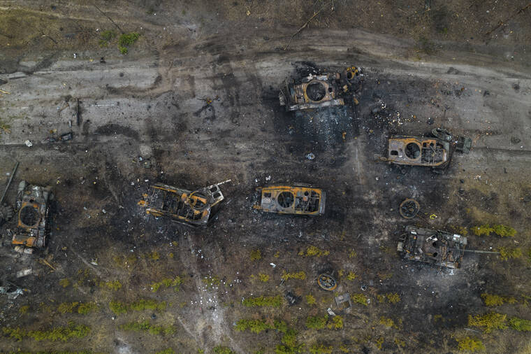 RODRIGO ABD / AP
                                Destroyed Russian armored vehicles are seen in the outskirts of Kyiv, Ukraine, Thursday. Russian forces shelled Kyiv suburbs, two days after the Kremlin announced it would significantly scale back operations near both the capital and the northern city of Chernihiv to “increase mutual trust and create conditions for further negotiations.”