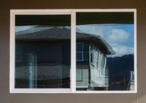 CINDY ELLEN RUSSELL / CRUSSELL@STARADVERTISER.COM
                                A Gentry-built home in the Kauluokahai subdivision is reflected in a neighbor’s window.
