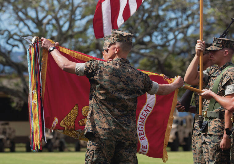 CINDY ELLEN RUSSELL / CRUSSELL@STARADVERTISER.COM
                                Marines closed the 3rd Marine Regiment flag Thursday during a ceremony at Marine Corps Base Hawaii that officially re-designated the regiment as the 3rd Marine Littoral Regiment.