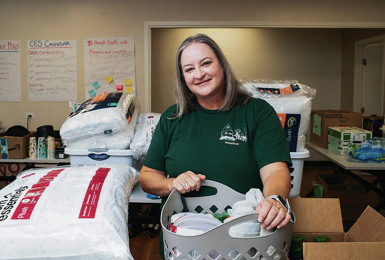 CINDY ELLEN RUSSELL / JUNE 25
                                Laura E. Thielen is executive director of Partners in Care, the nonprofit organization tracking the homeless population and its needs. She is pictured with community donations for the Housing First program.