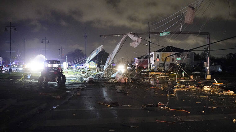 GERALD HERBERT / AP
                                A debris lined street is seen in the Lower 9th Ward in New Orleans after strong storms moved through the area.