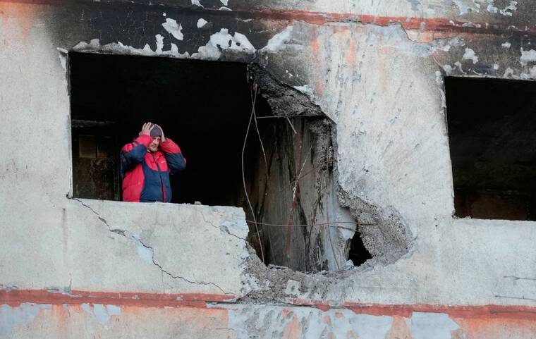 ASSOCIATED PRESS
                                A man held his head as he stood in his apartment in a multi-story house that was destroyed following a Russian attack in Kharkiv, Ukraine, today.