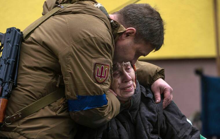ASSOCIATED PRESS
                                A soldier comforted Larysa Kolesnyk, 82, after she was evacuated from Irpin, on the outskirts of Kyiv, Ukraine, today.