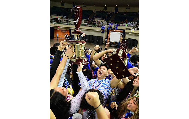 STEVEN ERLER / SPECIAL TO THE HONOLULU STAR-ADVERTISER
                                The Moanalua boys and girls wrestling teams celebrated with both trophies each sweeping both titles in Saturday’s state tourney at the Blaisdell Arena.