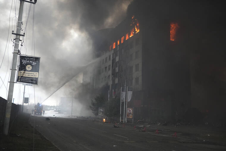 ASSOCIATED PRESS
                                Firefighters extinguishes a burning building today after bombing in Kyiv, Ukraine. Russian forces have escalated their attacks on crowded cities in what Ukraine’s leader called a blatant campaign of terror.