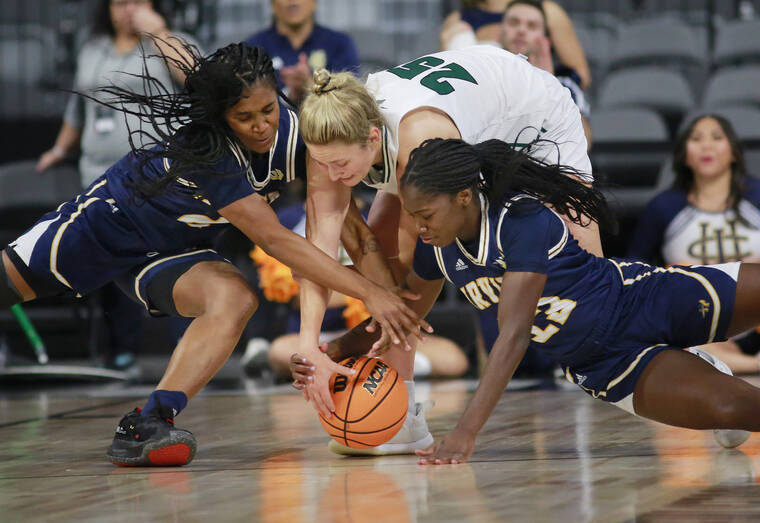 ASSOCIATED PRESS
                                From left to right, UC Irvine guard Chloe Webb (2), Hawaii forward Amy Atwell (25) and UC Irvine guard Deja Lee (13) go after a ball during the first half.