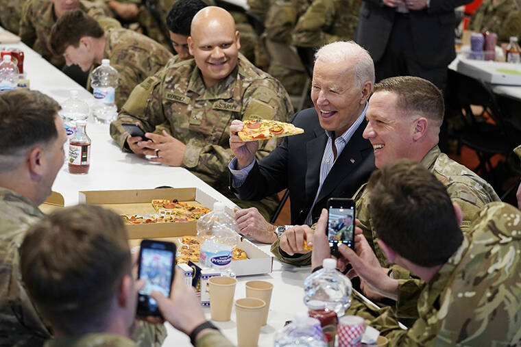 EVAN VUCCI / AP
                                President Joe Biden visits with members of the 82nd Airborne Division at the G2A Arena in Jasionka, Poland.
