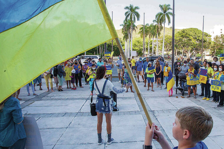 CINDY ELLEN RUSSELL / CRUSSELL@STARADVERTISER.COM
                                About 90 people attended Friday’s rally at the state Capitol to protest the Russian invasion of Ukraine. They waved flags and demanded that the United States and its allies go beyond economic sanctions.
