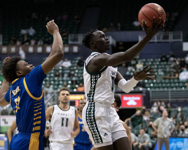 GEORGE F. LEE / GLEE@STARADVERTISER.COM
                                Hawaii’s Junior Madut went for a layup against Cal State Bakersfield on Feb. 26.