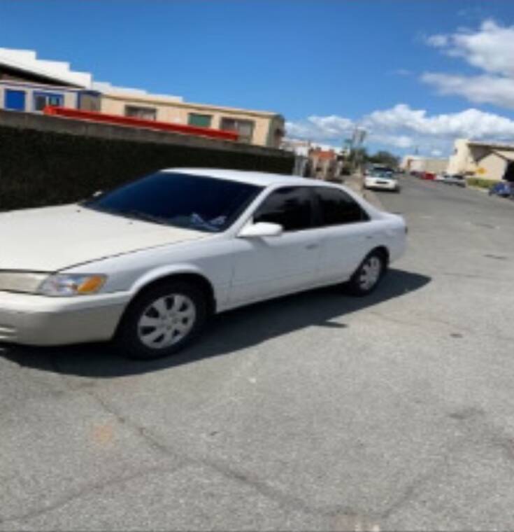 COURTESY HPD
                                Police are looking for two suspects who fled the Tantalus area in a white 1998 Toyota Camry after a fatal shooting that left an 18-year-old boy dead.