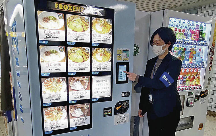 JAPAN NEWS-YOMIURI 
                                A vending machine dispenses restaurant-quality ramen and gyoza at a Tokyo subway station.