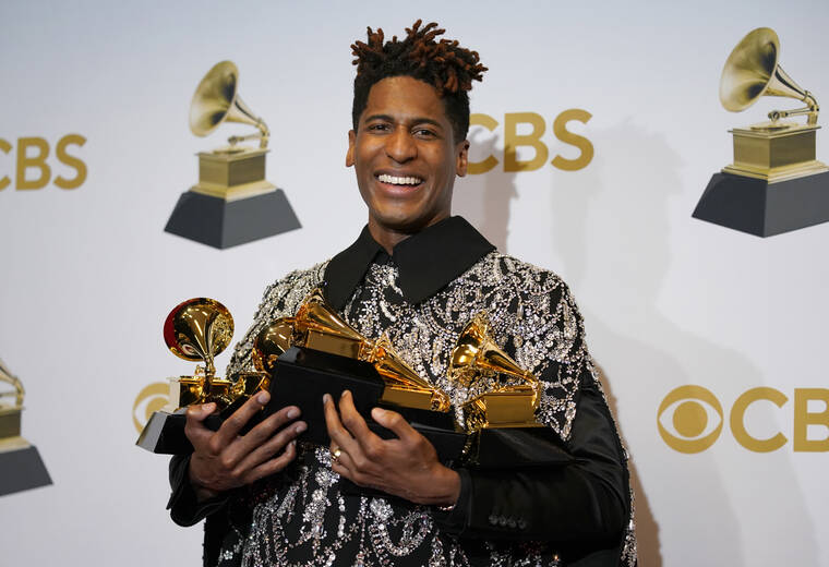 ASSOCIATED PRESS
                                Jon Batiste, winner of the awards for best American roots performance for “Cry,” best American roots song for “Cry,” best music video for “Freedom,” best score soundtrack for visual media for “Soul,” and album of the year for “We Are,” poses in the press room at the 64th Annual Grammy Awards at the MGM Grand Garden Arena on Sunday in Las Vegas.