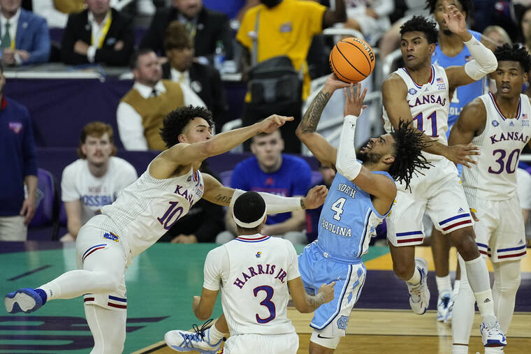 ASSOCIATED PRESS North Carolina guard R.J. Davis (4) shoots against Kansas forward Jalen Wilson (10) during the first half of a college basketball game in the finals of the Mens Final Four NCAA tournament today.