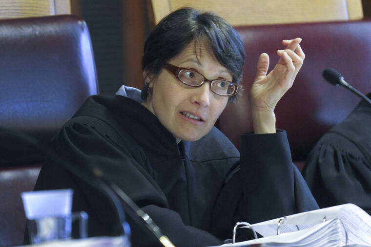 ASSOCIATED PRESS
                                Court of Appeals judge Jenny Rivera listened to oral arguments during a cross-examination at the Court of Appeals, in June 2016, in Albany, N.Y. Rivera, one of seven jurists on New York’s highest court, is no longer allowed in the courtroom and has been referred to a disciplinary committee because she hasn’t complied with a rule requiring all court personnel to provide proof they’ve been vaccinated against COVID-19.