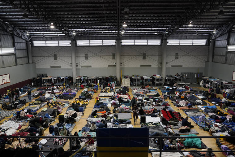 ASSOCIATED PRESS / APRIL 5
                                Ukrainian refugees wait in a gymnasium in Tijuana, Mexico.