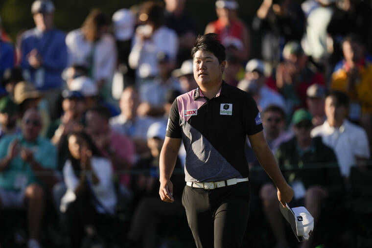 ASSOCIATED PRESS
                                Sungjae Im, of South Korea, walks on the 18th green following the first round at the Masters.
