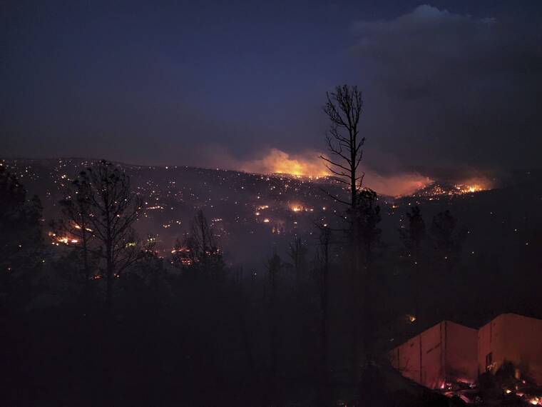 ALEXANDER MEDITZ / AP
                                Fire burns along a hillside in the Village of Ruidoso, N.M., on Wednesday, April 13.