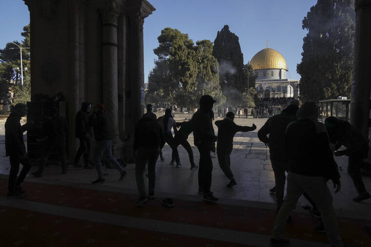 ASSOCIATED PRESS
                                Palestinians clash with Israeli security forces at the Al Aqsa Mosque compound in Jerusalem’s Old City.