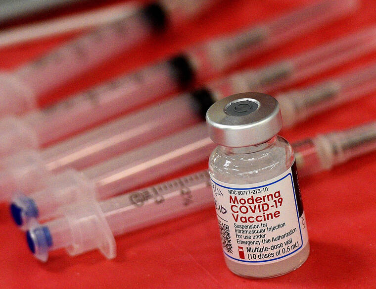 RICK WEST/DAILY HERALD VIA ASSOCIATED PRESS Syringes and a vial of the Moderna COVID-19 vaccine were displayed at a mass COVID-19 vaccination site in Batavia, Ill., in March 2021. Moderna hopes to offer updated COVID-19 boosters in the fall that combine its original vaccine with protection against the omicron variant.