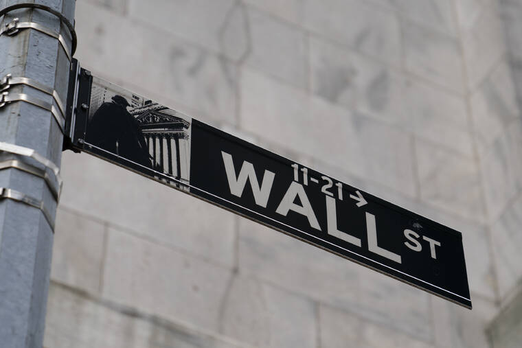 ASSOCIATED PRESS
                                A Wall Street sign was shown in the Financial District, in October2021, in the Manhattan borough of New York. Stocks overcame a weak start and finished broadly higher today, giving the major indexes on Wall Street their best day in nearly five weeks.