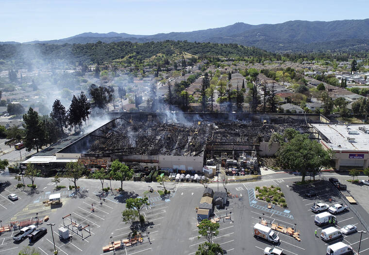BAY AREA NEWS GROUP / AP / APRIL 10
                                Smoke rises from an extinguished fire at the Home Depot off Blossom Hill Road in San Jose, Calif.