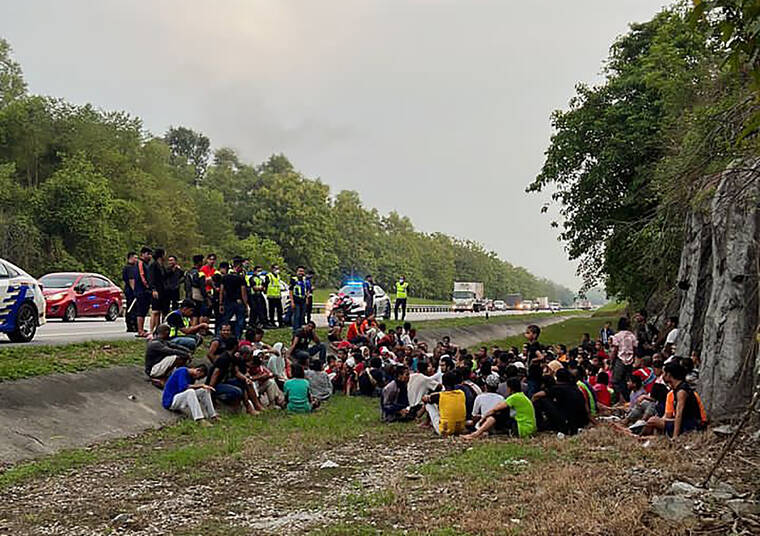 MALAYSIA ROYAL POLICE VIA AP
                                Police detain Rohingya refugees who had escaped from the Sungai Bakap Temporary Immigration Depot, Penang, Malaysia.