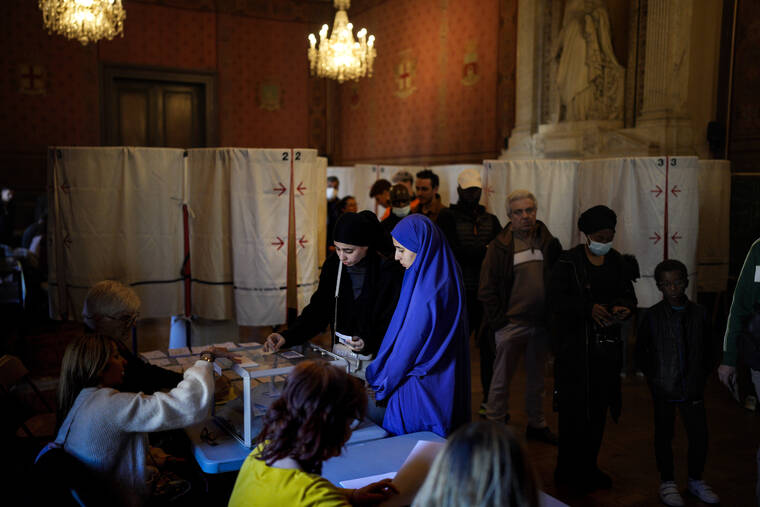 ASSOCIATED PRESS
                                Voters casts their ballots for the first round of the presidential election in Marseille, France, on April 10.