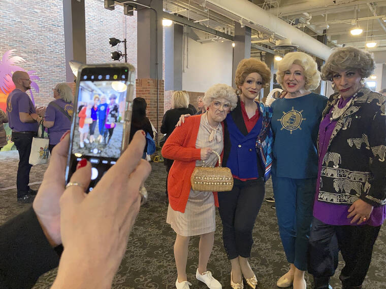 ASSOCIATED PRESS / APRIL 22
                                Drag queen performers dressed as characters from “The Golden Girls” pose for a photo at the Navy Pier in Chicago.