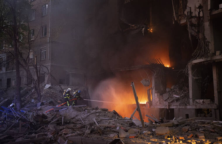 ASSOCIATED PRESS
                                Firefighters tried to put out a fire following an explosion in Kyiv, Ukraine, on Thursday. Russia mounted attacks across a wide area of Ukraine on Thursday, bombarding Kyiv during a visit by the head of the United Nations.