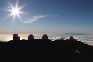 ASSOCIATED PRESS
                                The sun sets behind telescopes on July 14, 2019, at the summit of Mauna Kea.