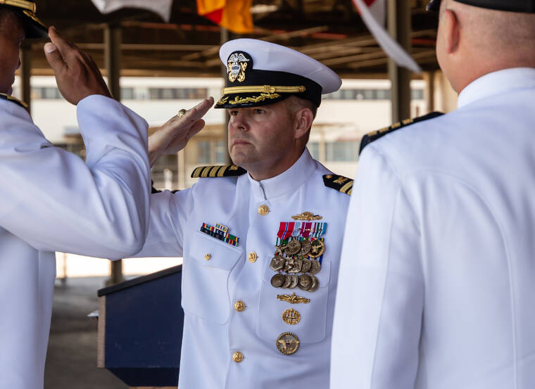 COURTESY U.S. NAVY
                                Capt. Albert Hornyak, center, salutes Rear Adm. Dion English, left, as he assumes command of NAVSUP Fleet Logistics Center Pearl Harbor from Capt. Trent Kalp, right, during a change of command ceremony on Joint Base Pearl Harbor-Hickam.
