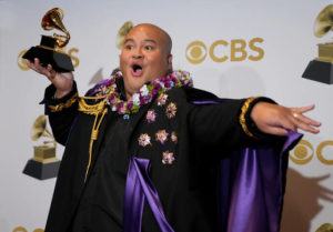 ASSOCIATED PRESS
                                Kalani Pe’a, winner of the award for best regional roots musical album for “Kau Ka Pe’a,” poses in the press room at the 64th Annual Grammy Awards at the MGM Grand Garden Arena on Sunday in Las Vegas.