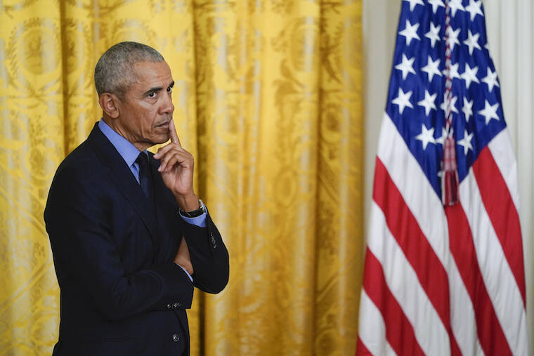 ASSOCIATED PRESS / APRIL 5
                                Former President Barack Obama listens as President Joe Biden speaks about the Affordable Care Act, in the East Room of the White House in Washington.