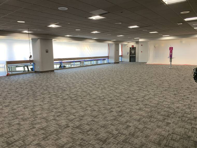 COURTESY HAWAII STATE DEPT. OF TRANSPORTATION
                                Crews worked hard to clean up the mess after the flooding Thursday morning, and by today, had already installed a new carpet at the A Gate lobby area at the airport’s Neighbor Island Terminal.