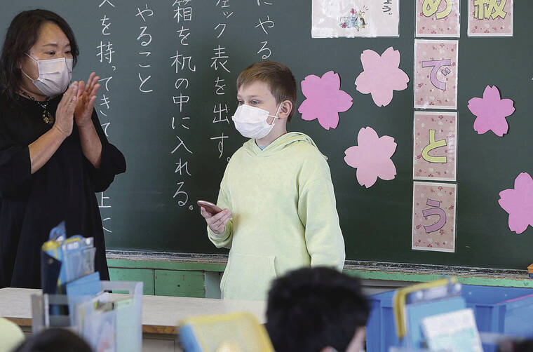JAPAN NEWS-YOMIURI
                                <strong>“I like sushi, and I like boxing.”</strong>
                                <strong>Yaroslav Boiko</strong>
                                <em>Fourth grader and refugee from Ukraine, above, introduces himself to his elementary school classmates in Obu, Japan</em>